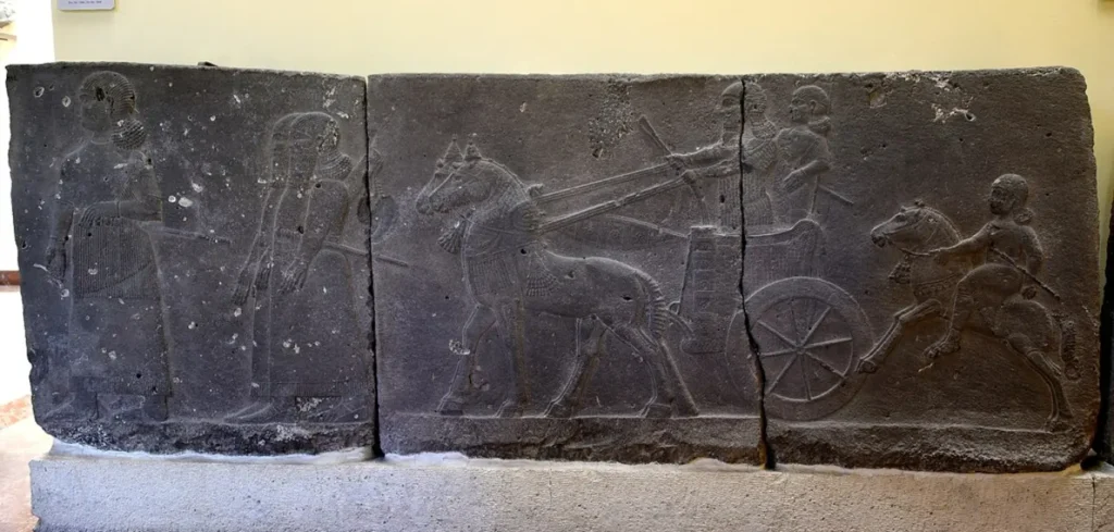 Museum relic depicting ancient war chariot to show medium of transportation in earlier times.
